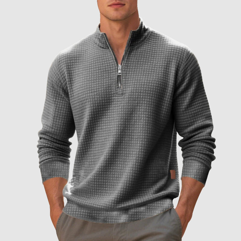 Grey waffle knit quarter-zip pullover with a stand collar, ribbed cuffs, and a textured grid pattern on a regular fit.