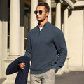 Dark blue quarter-zip sweater in a structured basket-weave knit with a tailored fit and metal hardware collar.
