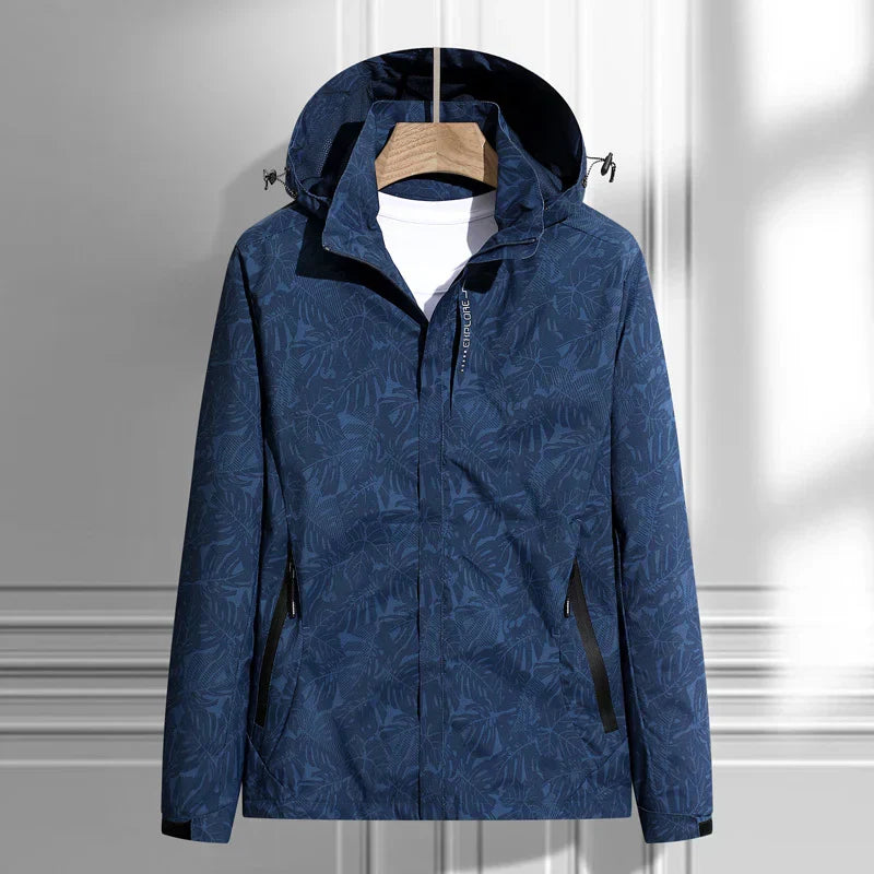 Navy hooded waterproof jacket featuring a full-zip closure, adjustable hood, zippered pockets, and long sleeves on a white background.
