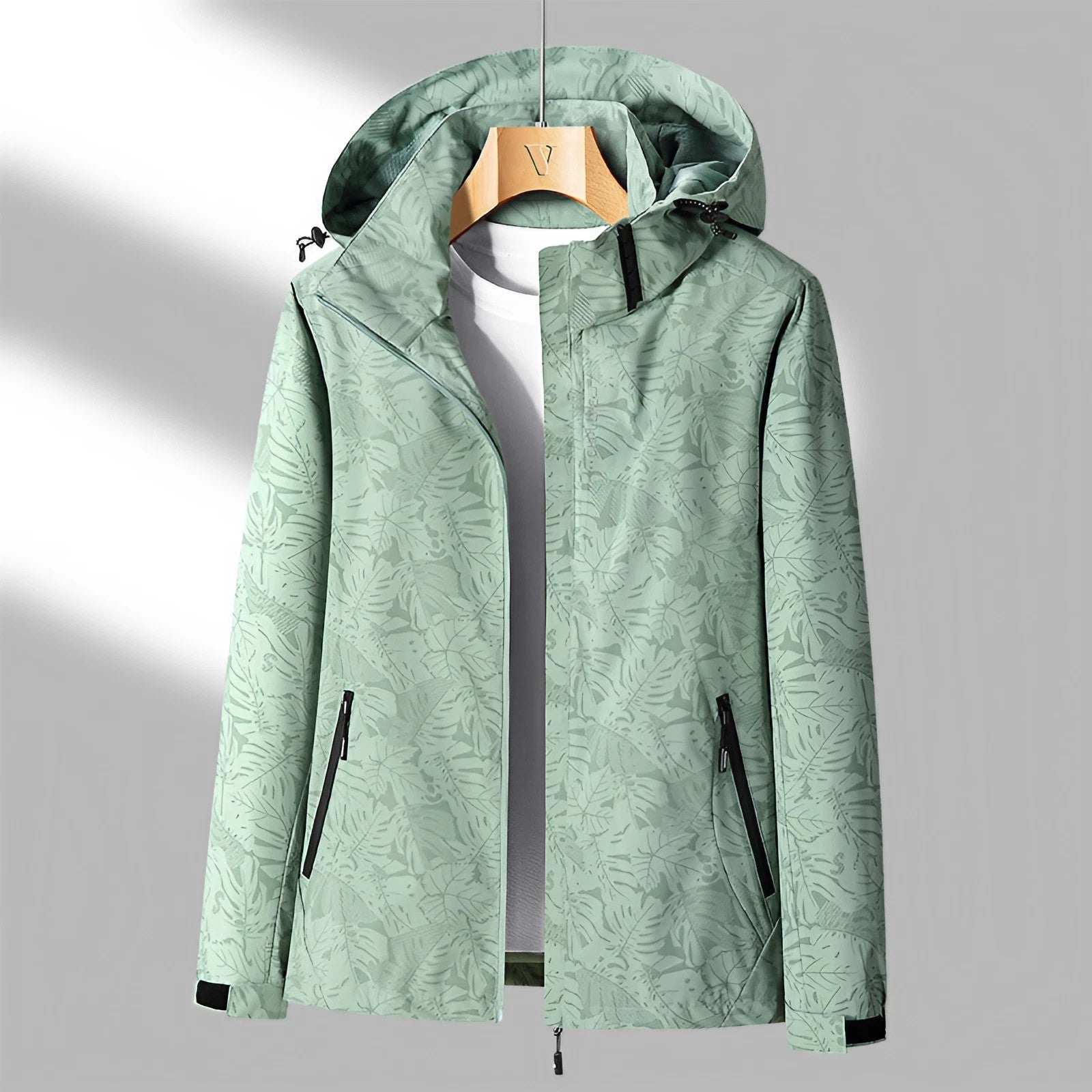 Olive green hooded waterproof jacket with a full-zip front, adjustable hood, zippered pockets, and long sleeves displayed on a white background.