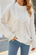 Off-white cable-knit crewneck sweater featuring a relaxed, drop-shoulder fit and intricate braided texture.