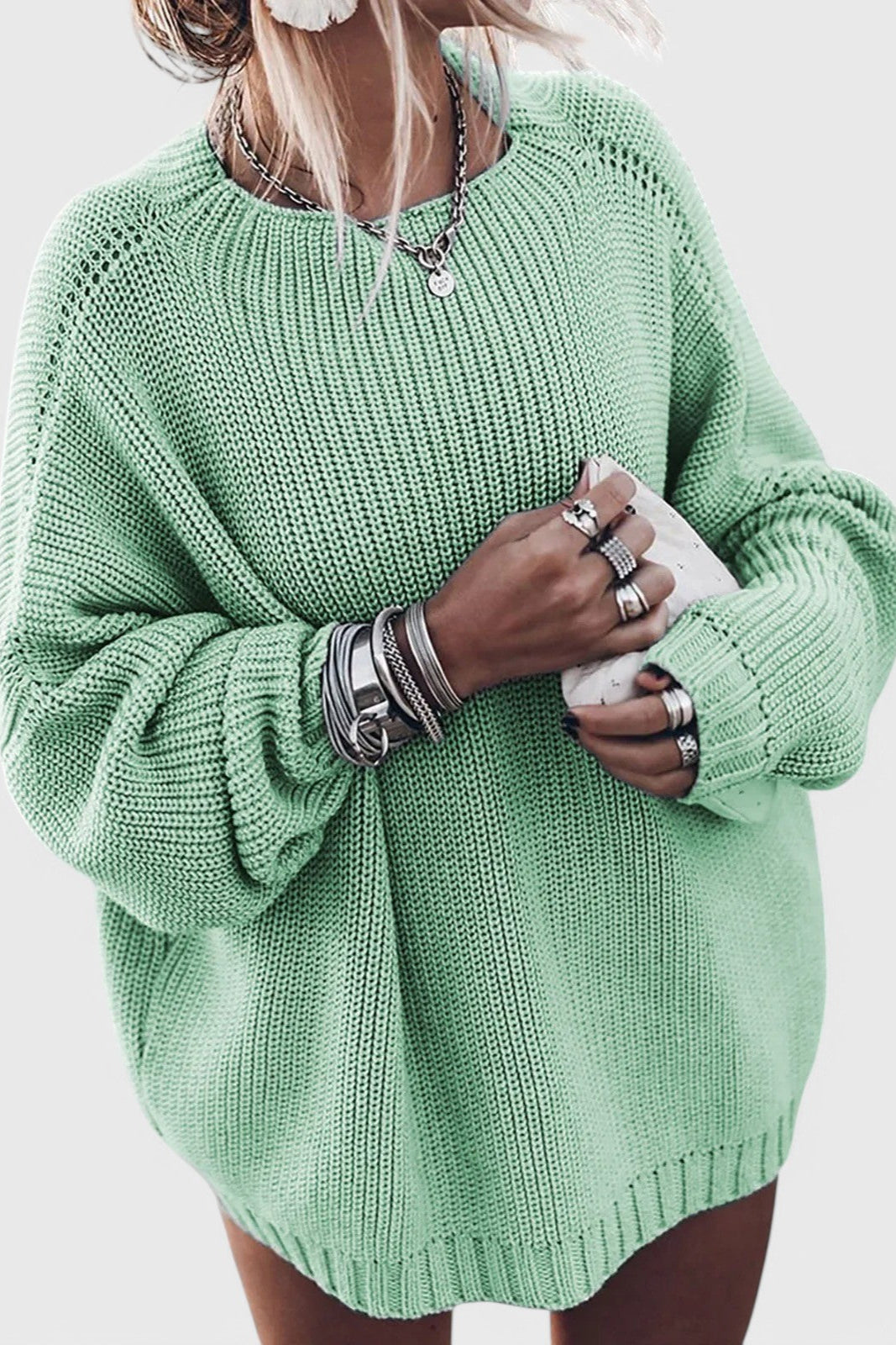 Mint green oversized chunky knit sweater with a ribbed crew neckline, textured knit pattern, and balloon sleeves.