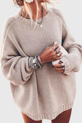 Beige oversized chunky knit sweater with a relaxed fit, ribbed crew neckline, and balloon sleeves for a cozy casual look.