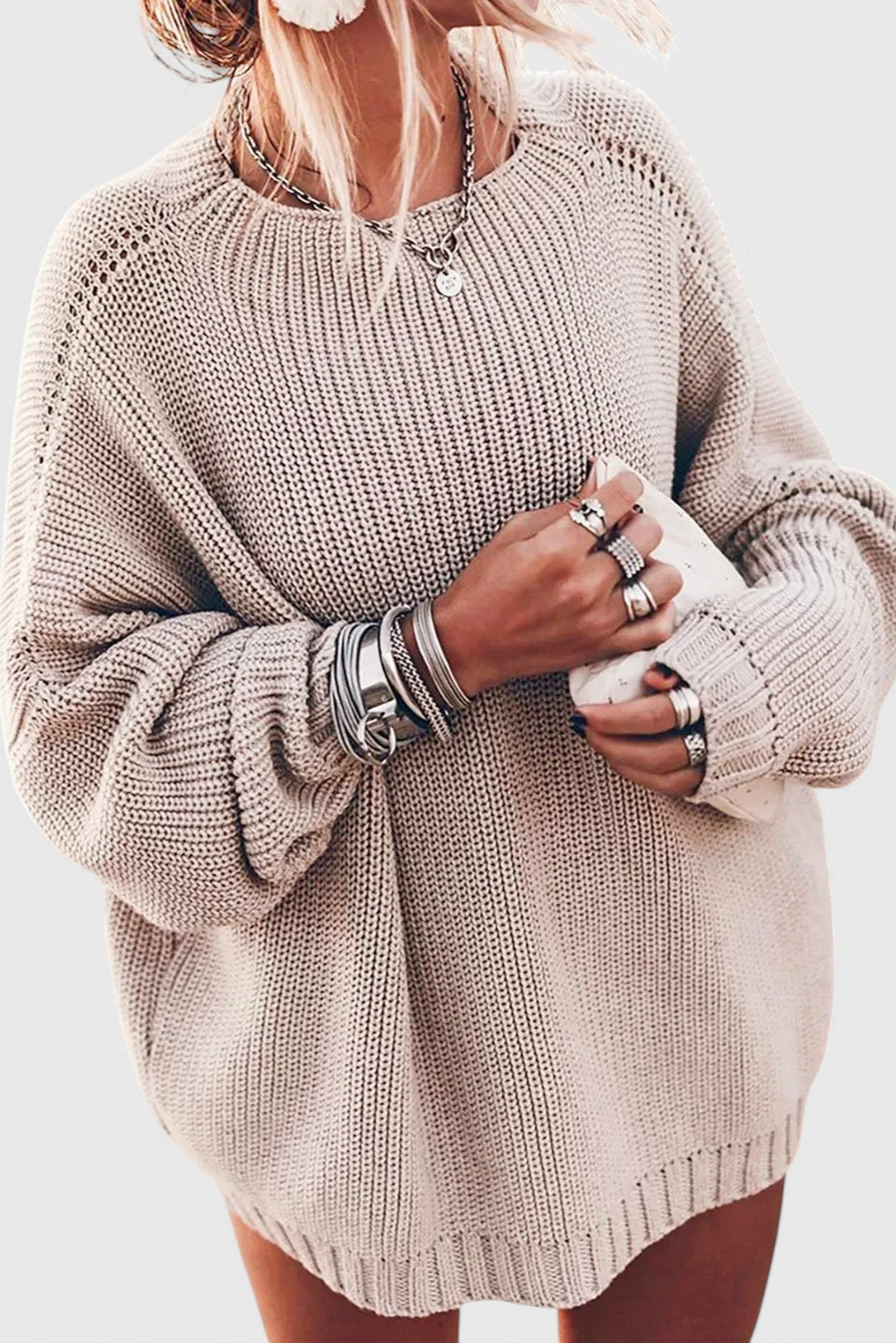 Beige oversized chunky knit sweater with a relaxed fit, ribbed crew neckline, and balloon sleeves for a cozy casual look.