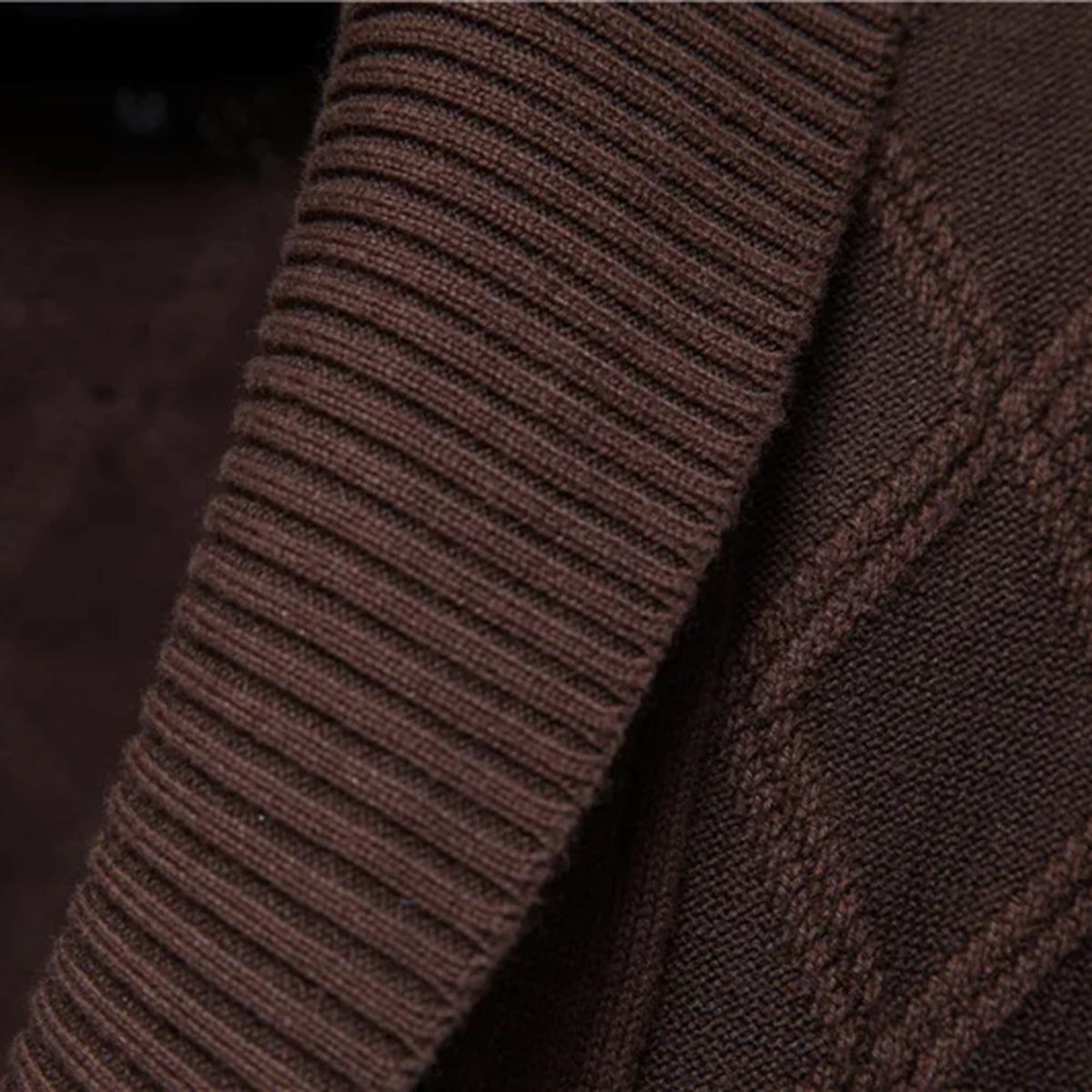 Dark brown stretch cotton cardigan featuring a ribbed shawl collar and textured diamond cable knit pattern.