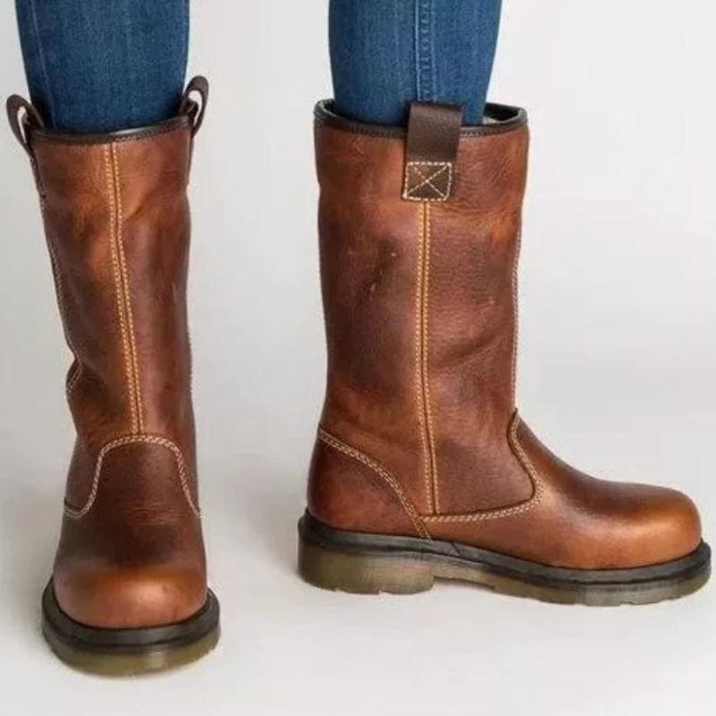 Brown slip-on mid-calf boots for women with the cuff worn up, showing the full shaft and contrast stitching