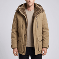 Khaki padded parka with a deep pile sherpa-lined hood, stand collar, and multiple utility pockets on a neutral background.