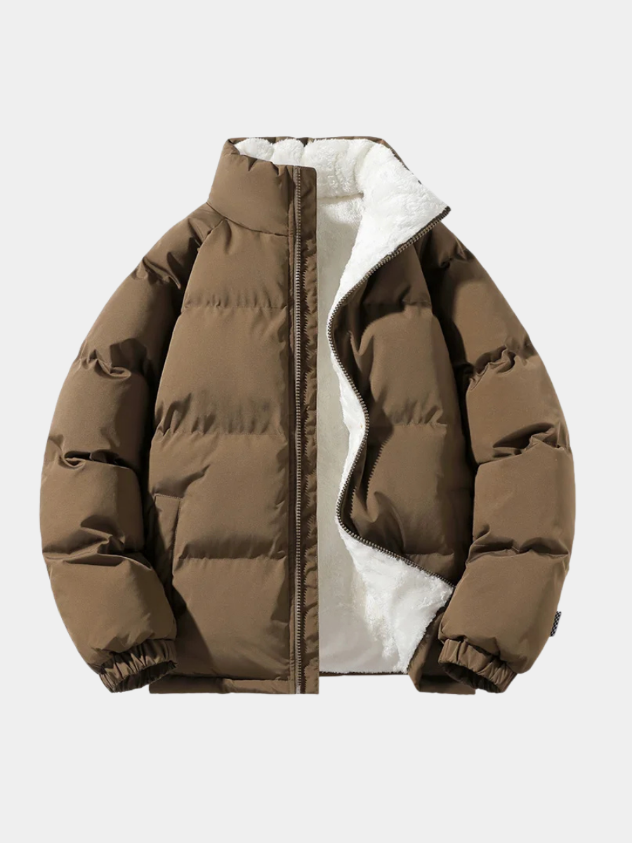 Brown quilted puffer jacket with a mock neck, full-zip front, and plush white sherpa lining in a boxy, hip-length fit.