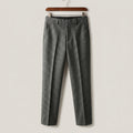 Slim-fit gray wool-blend trousers featuring a tailored silhouette, subtle leg pleats, and a refined textured finish.