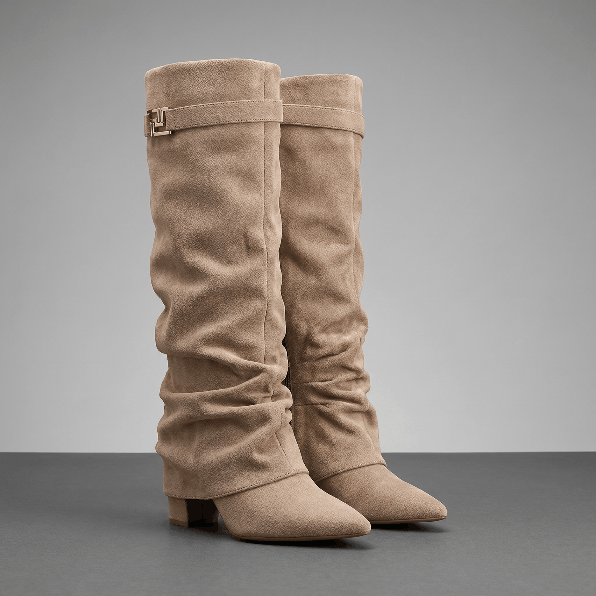 Slouchy Fold-Over Boots – Beige suede-look knee-high boots with pointed toes and strap detail