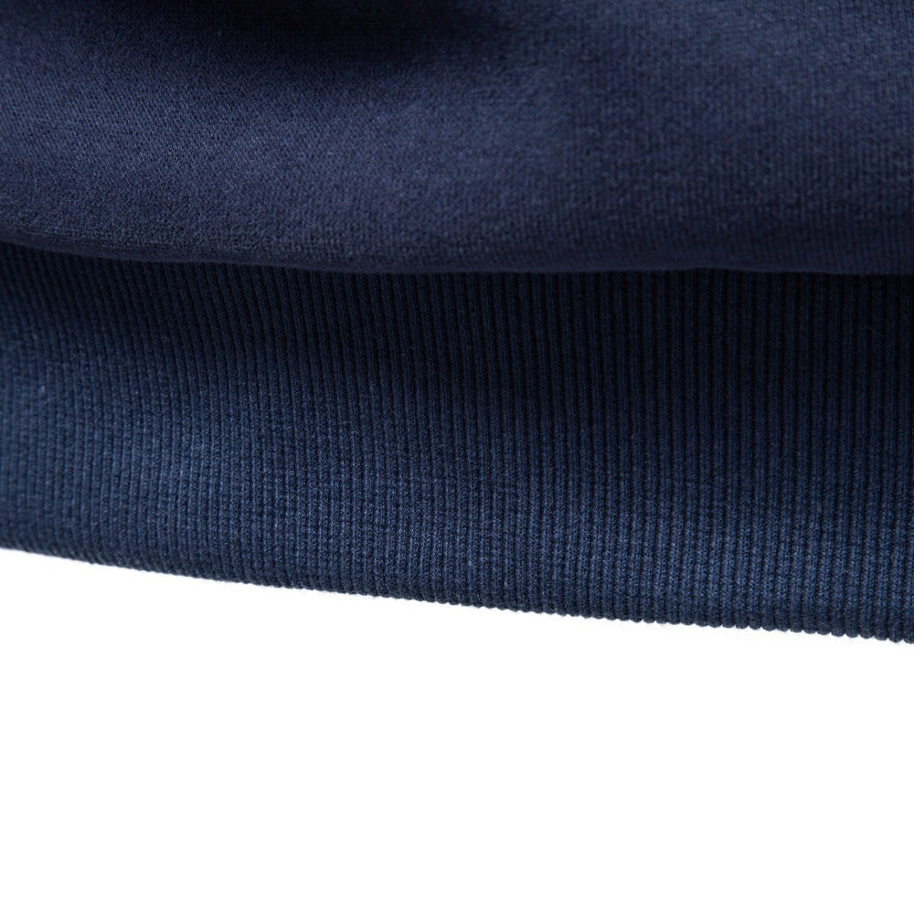 Close-up of navy sweatshirt showing ribbed hem