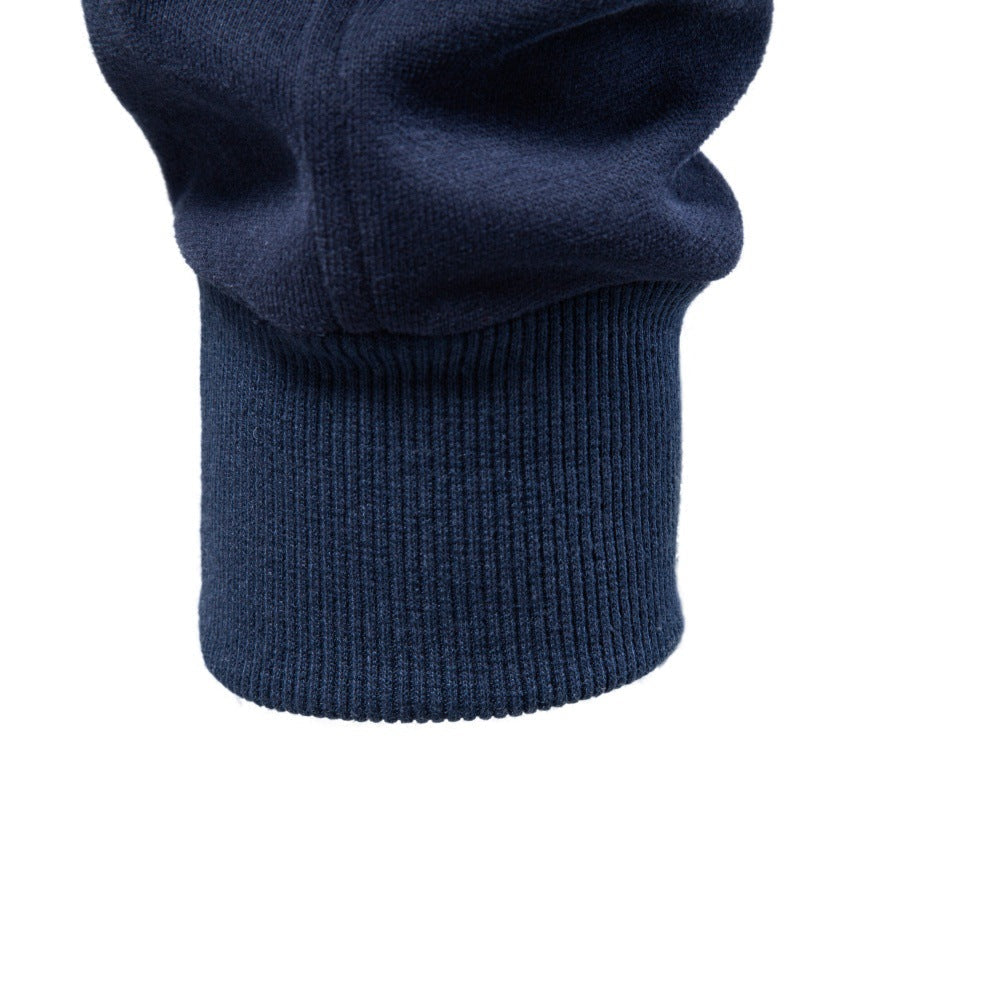 Close-up of navy sweatshirt showing ribbed sleeve cuff