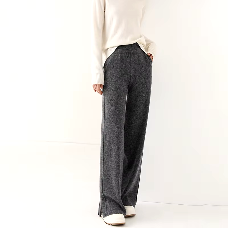 Front view of a model wearing dark gray straight-leg wool knit pants paired with a white top.