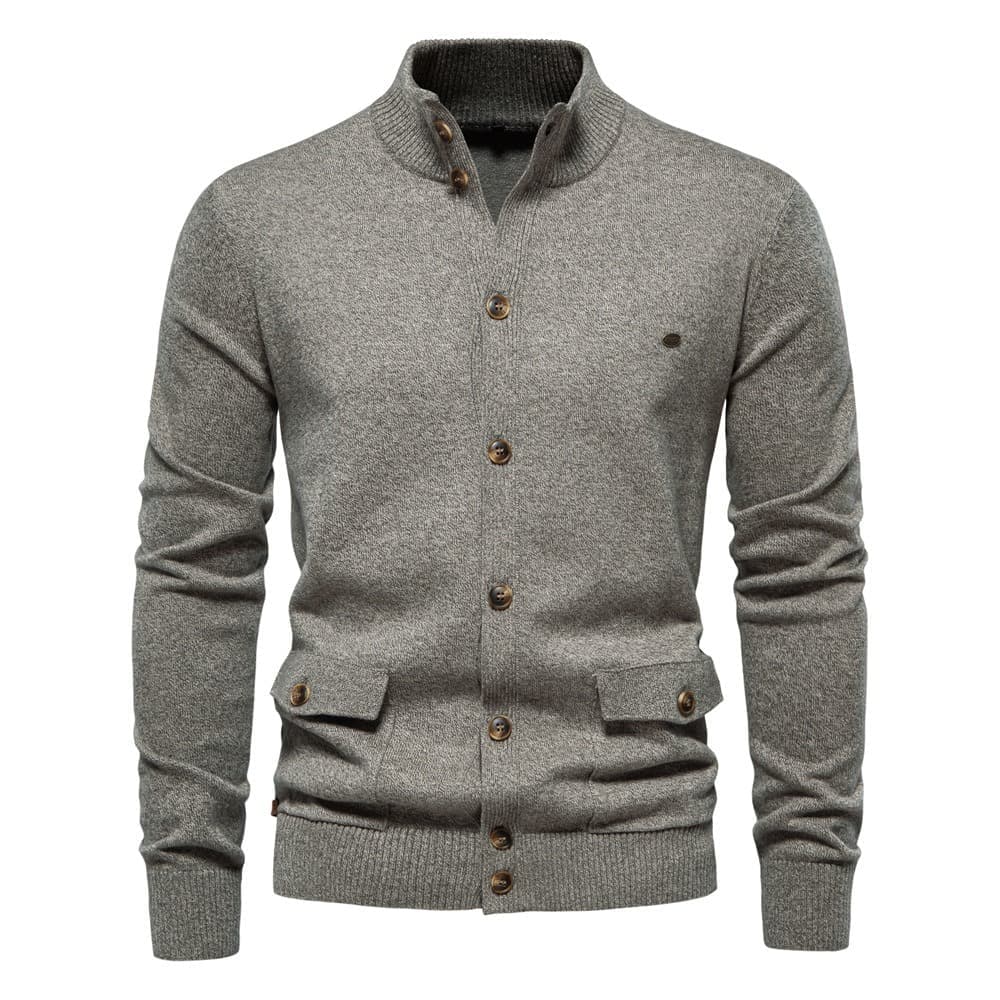 Grey stretch cotton knit cardigan with a stand collar, button front, and two utility-style flap pockets.