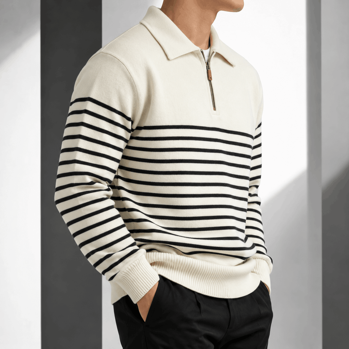 Cream striped quarter-zip polo worn by a male model, shown from the front with a solid yoke and contrast horizontal stripes.