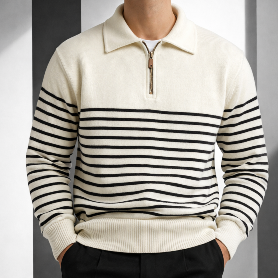 Cream and navy striped cotton knit quarter-zip polo worn by a male model, featuring a solid yoke and contrast pull tab.