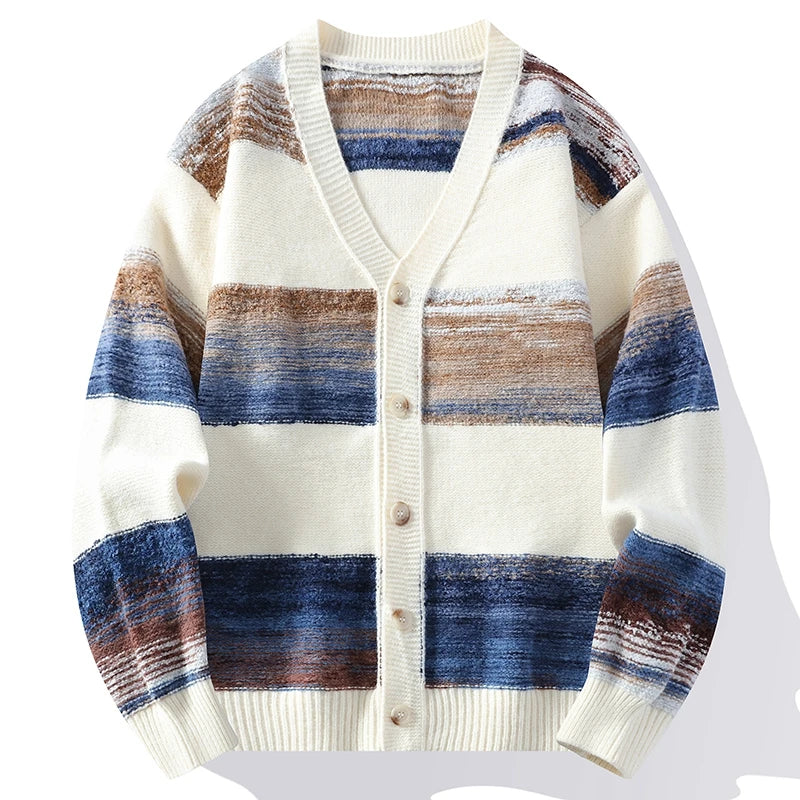 V-neck knit cardigan featuring a rippled stripe pattern in blue, brown, and cream with a button-front and ribbed trim.