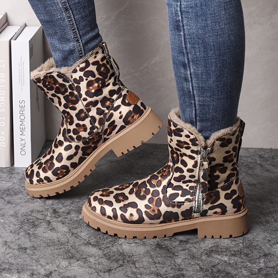 Leopard print ankle boots for women with fur-look collar and lug sole, worn with skinny jeans