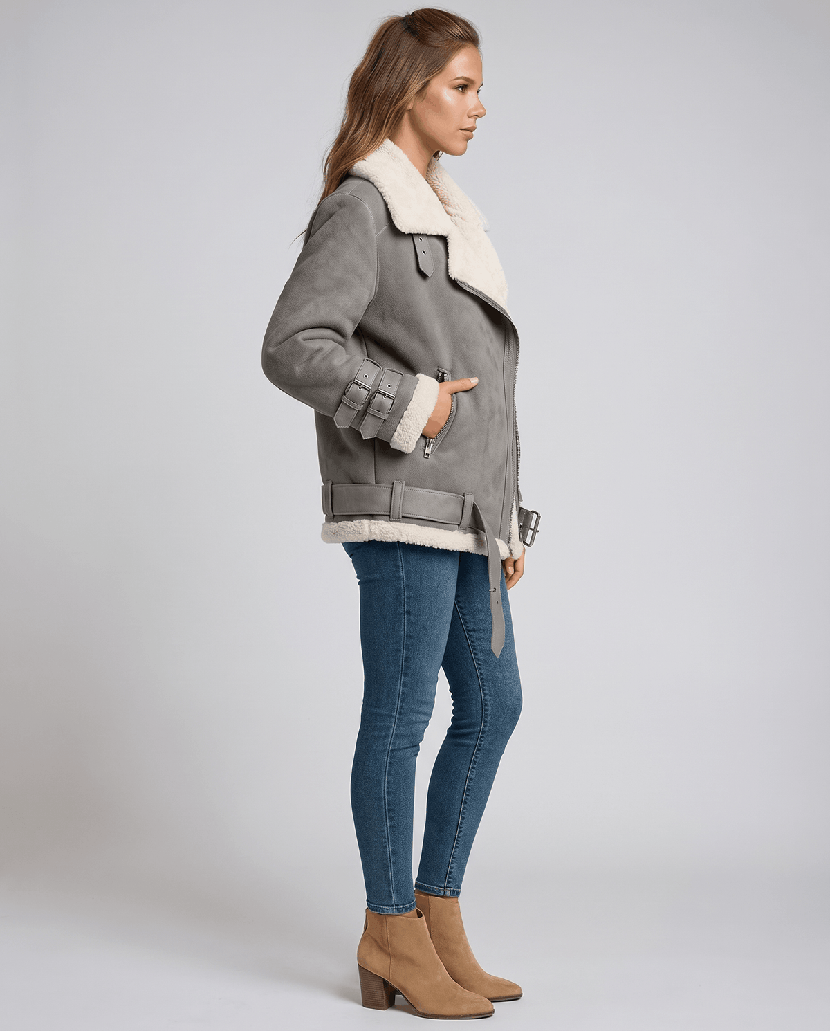Gray suede aviator jacket with plush sheepskin lining, wide collar, buckle cuffs, and side zip closure.