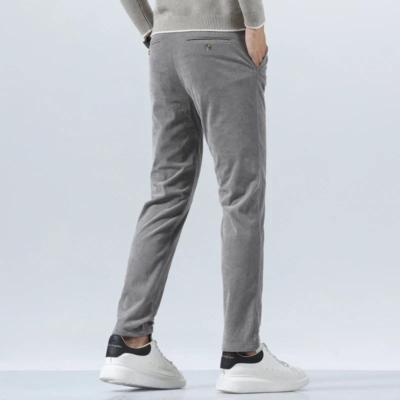 Gray straight-leg corduroy pants in a heavyweight cotton blend with a clean tailored fit and rear buttoned pockets.