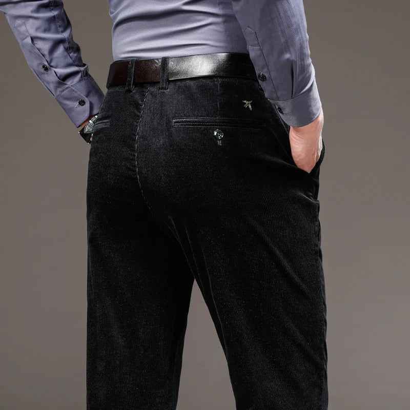 Black corduroy pants showing the back pocket and tailored fit