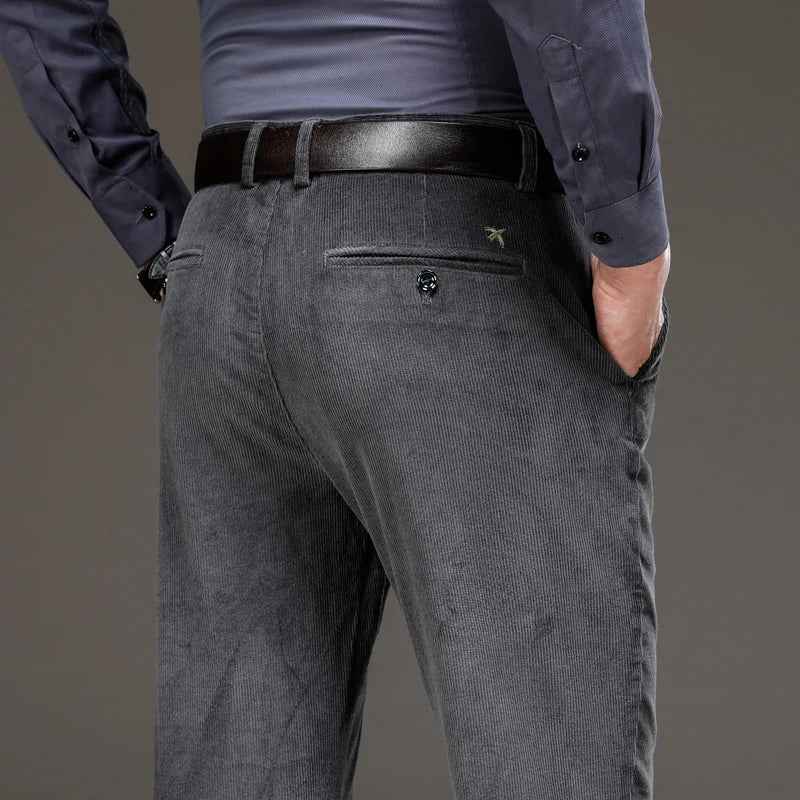 Gray corduroy pants showing the back pocket and textured fabric
