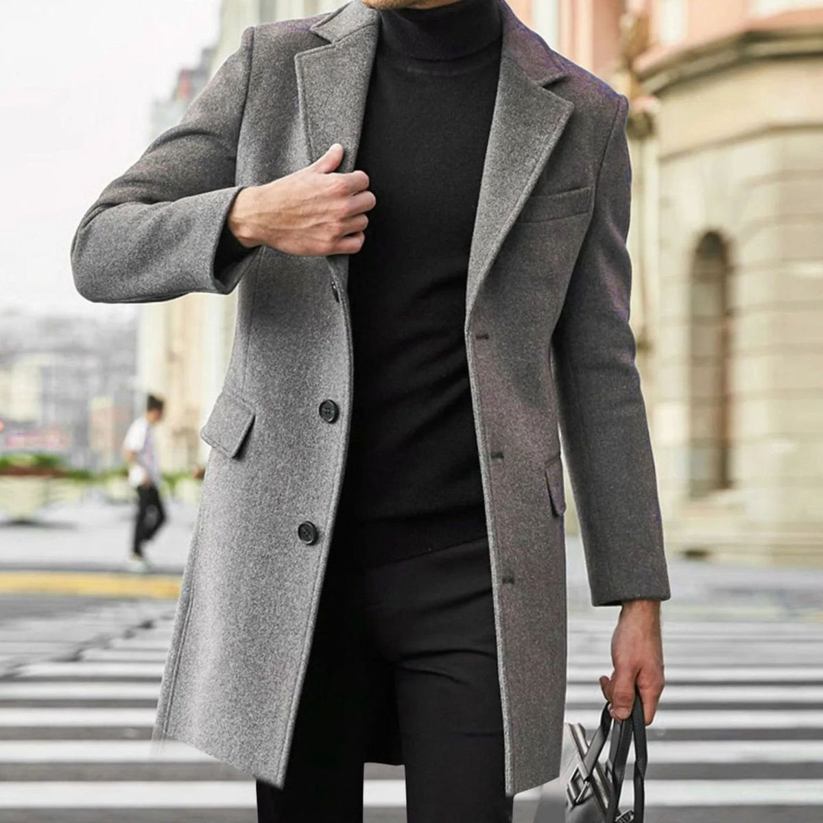 Gray Tailored Single-Breasted Overcoat worn by a male model, featuring notch lapels, a button front, flap pockets, and a structured tailored fit.