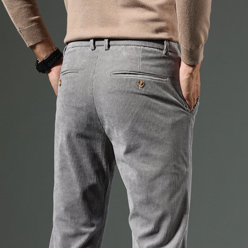 Gray corduroy pants showing the back waistband and rear pocket detail
