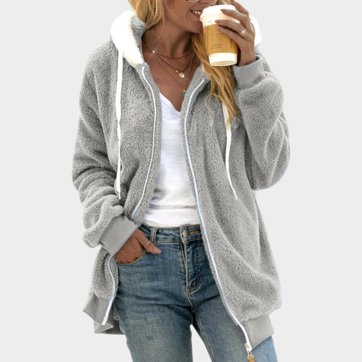Teddy Fleece Zip-Up Hoodie – Gray teddy fleece hoodie worn by a female model with contrast sherpa trim and side pockets