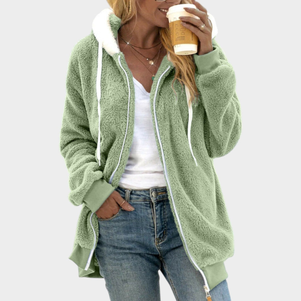 Teddy Fleece Zip-Up Hoodie – Green teddy fleece hoodie worn by a female model with contrast sherpa trim and side pockets