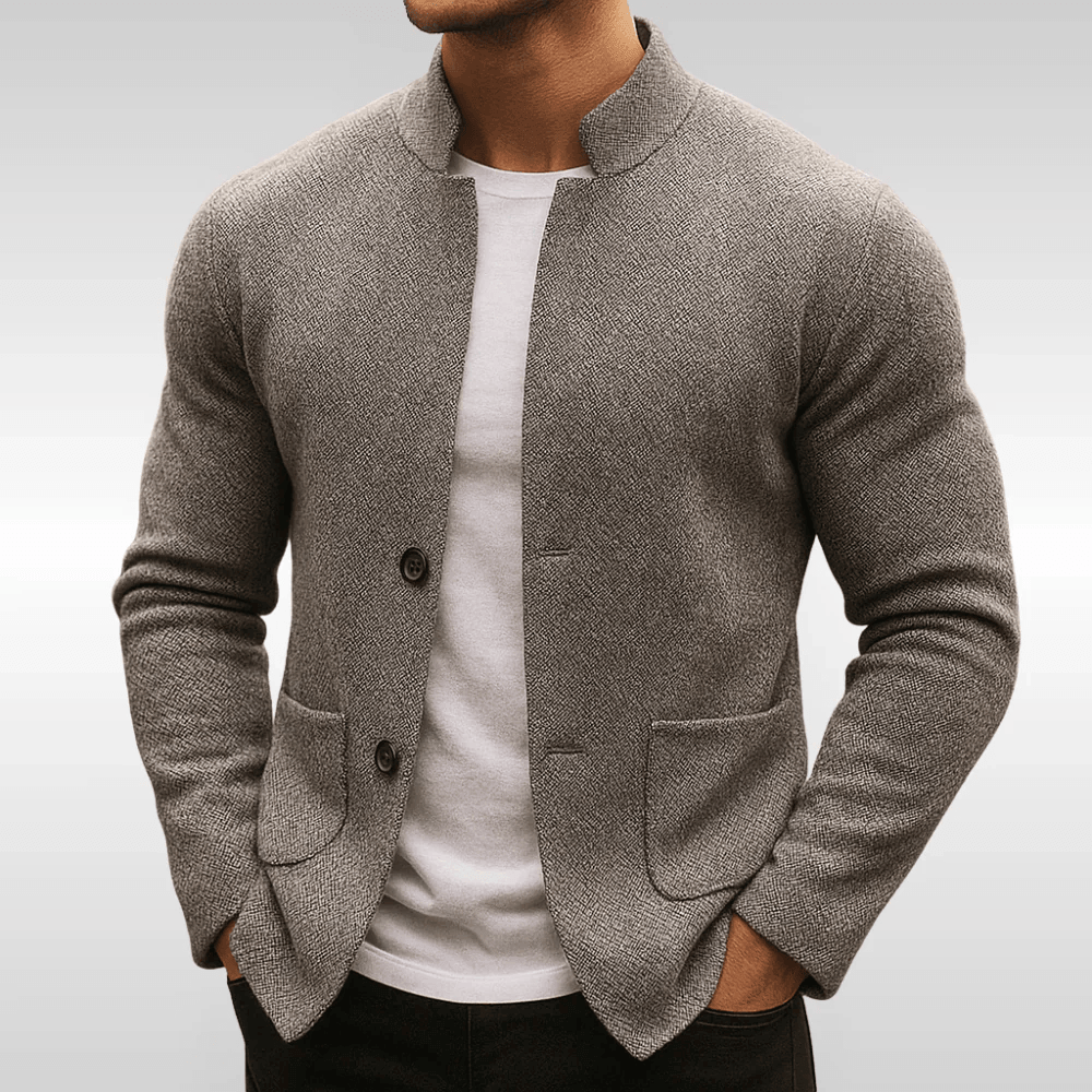Gray textured knit cardigan with a mandarin collar, button front, and flat patch pockets worn over a white crew-neck tee.