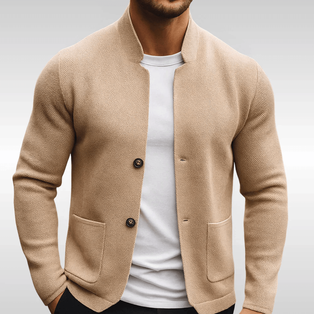Beige textured knit cardigan featuring a mandarin collar, two-button front, and flat patch pockets over a white tee.