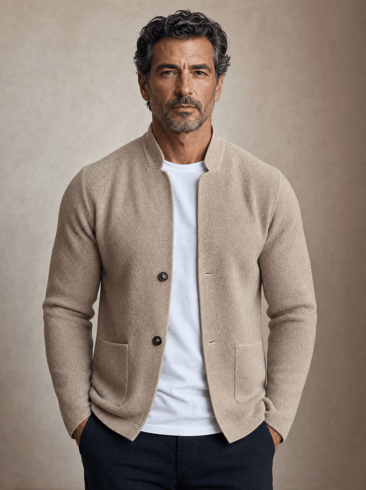 Beige textured knit cardigan with a mandarin collar, button front, and patch pockets worn over a white crew-neck tee.