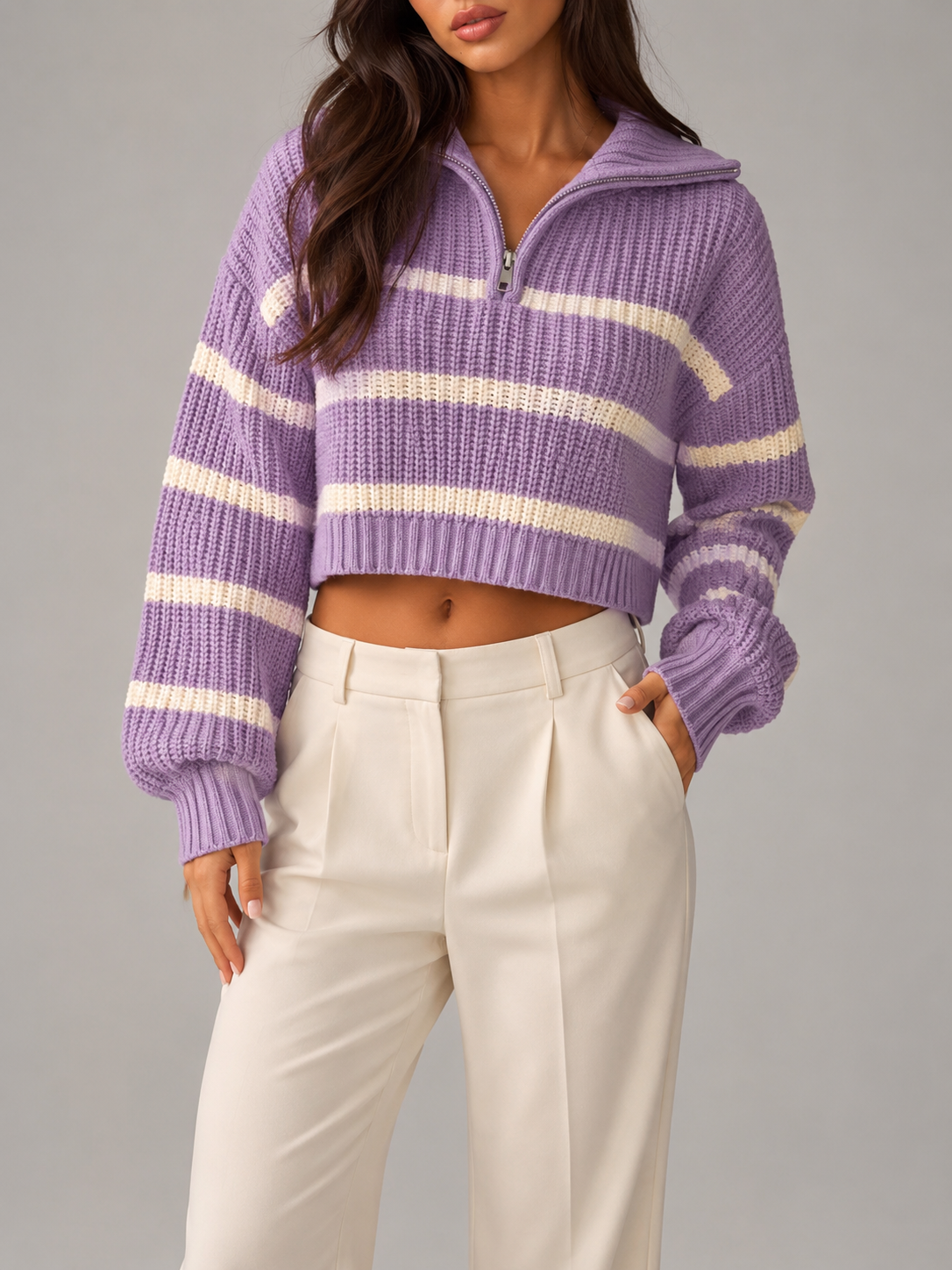 Purple and cream striped half-zip sweater in a mid-weight knit with a relaxed drop-shoulder fit and ribbed cuffs.