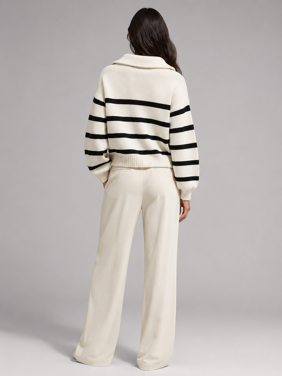Striped mid-weight knit half-zip sweater with a relaxed drop-shoulder fit, ribbed cuffs, and a convertible stand collar.