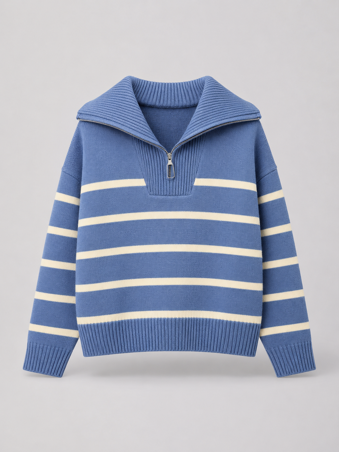 Blue and cream striped mid-weight knit sweater with a half-zip stand collar, drop shoulders, and ribbed trim.