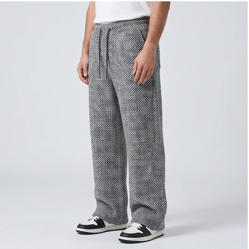 Men’s wide-leg tweed sweatpants in gray herringbone wool-blend with an elastic drawstring waist and full-length fit.