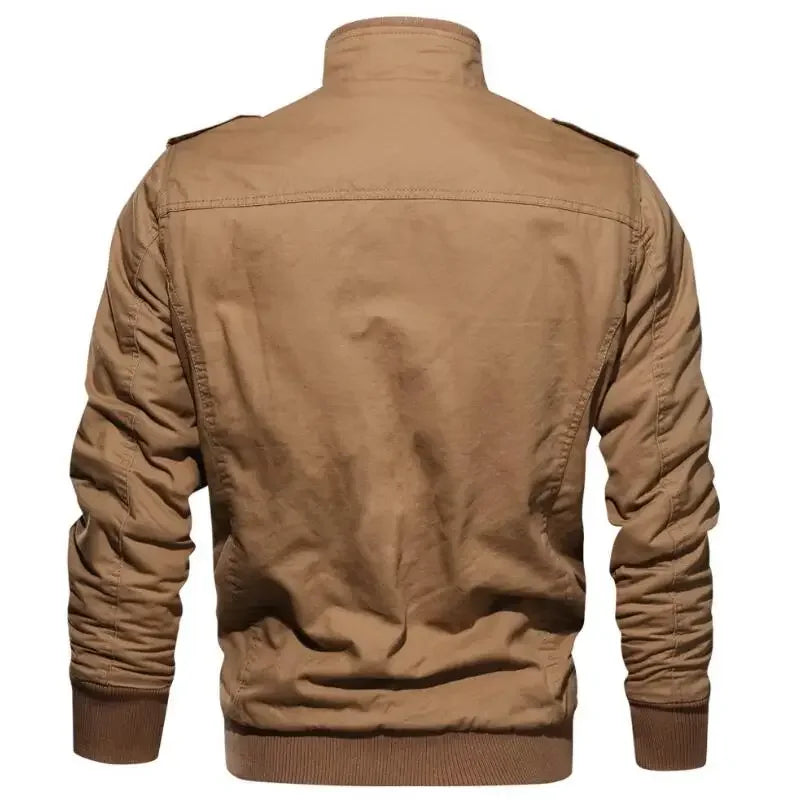 Back view of the tan utility field jacket showing the high stand collar, shoulder yoke construction, ribbed cuffs, and ribbed waistband hem.