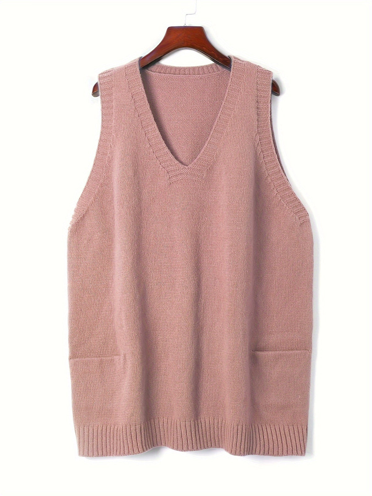Front product hanging view of the fuzzy knit V-neck sweater vest in dusty rose pink featuring deep side patch pockets.