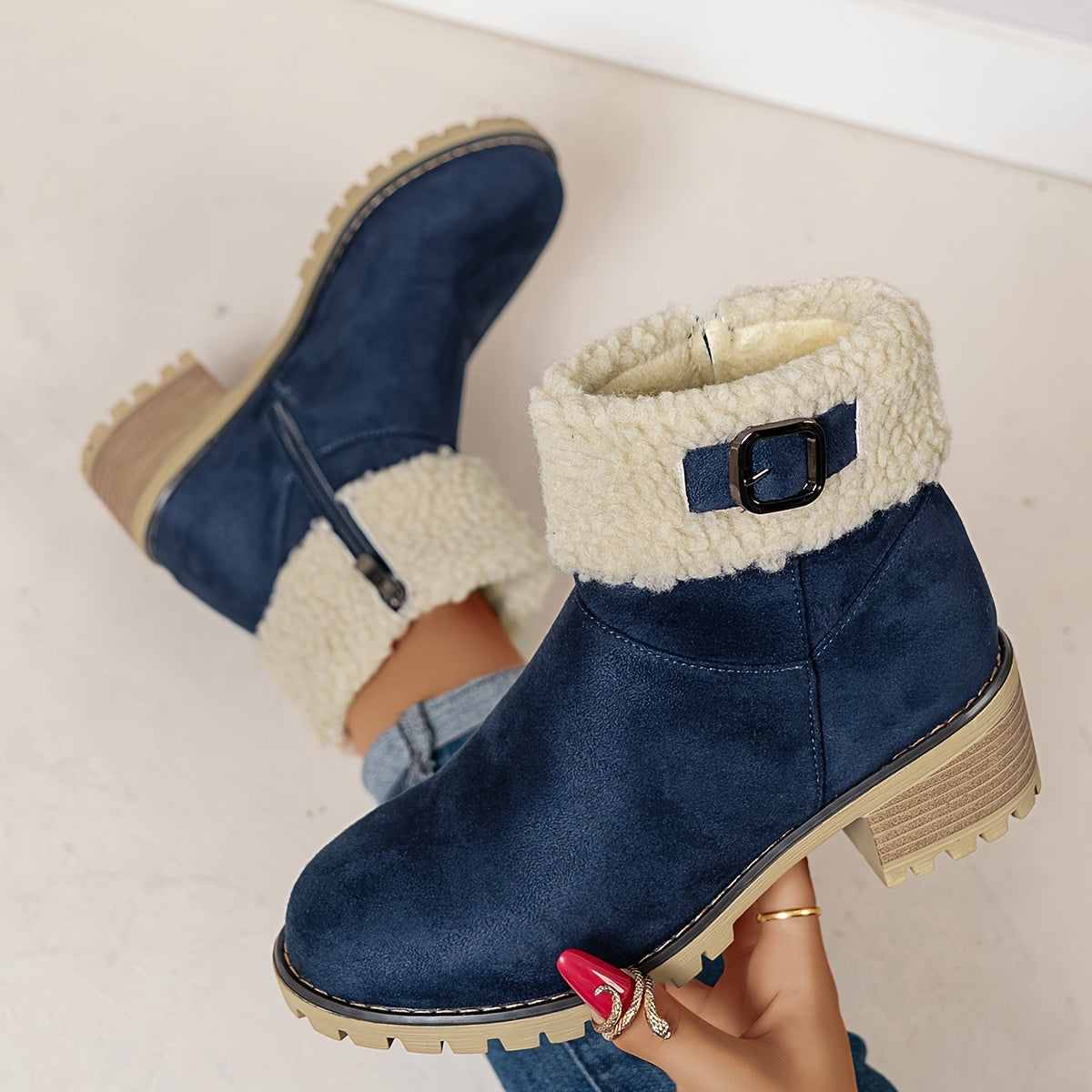 Navy vegan suede ankle boots for women with sherpa cuff and side zip running down the inner side