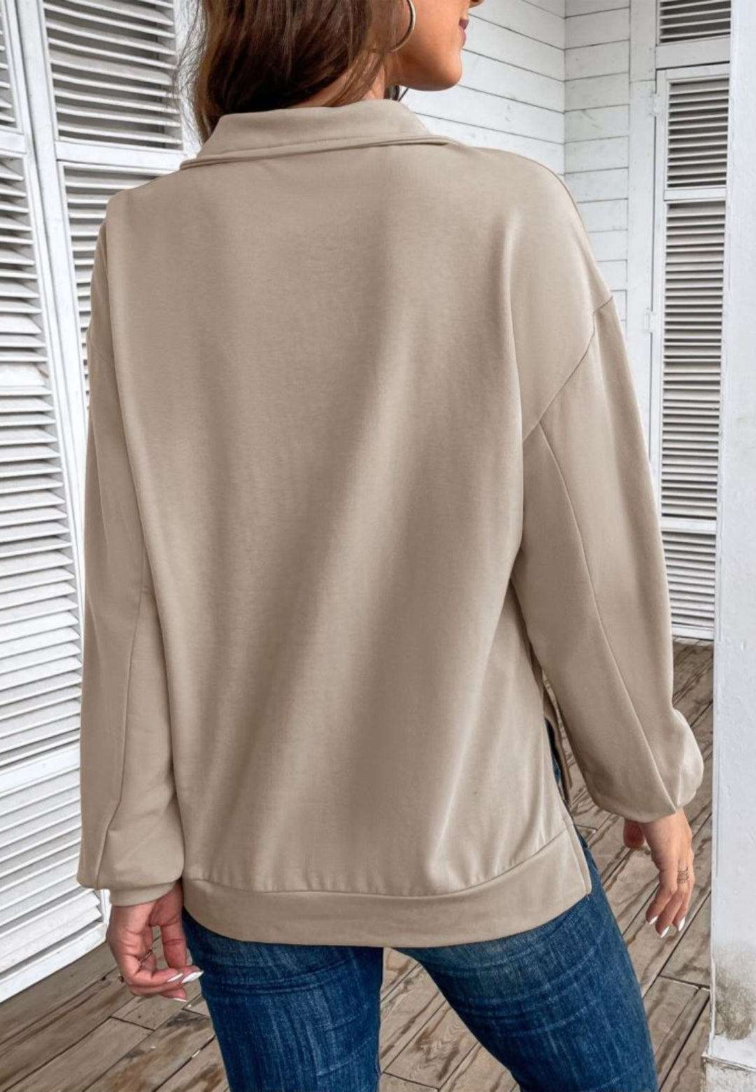 Beige quarter-zip sweatshirt in stretch jersey with a folded point collar, dropped shoulders, and a loose, boxy fit.