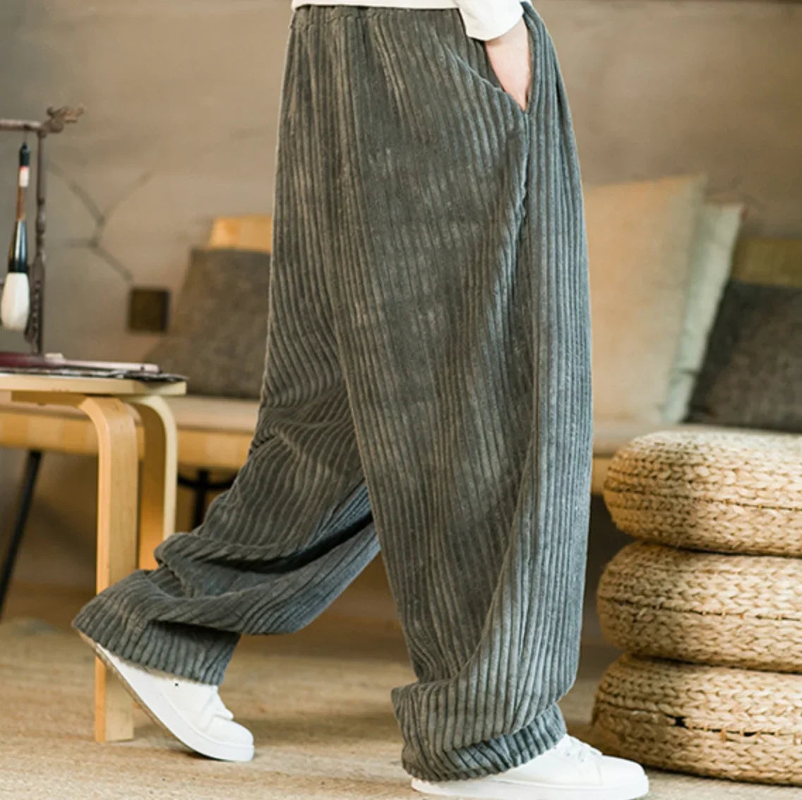 Gray corduroy wide-leg pants shown from the side
