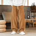 Wide-leg brown corduroy pants with elastic drawstring waist and deep side pockets