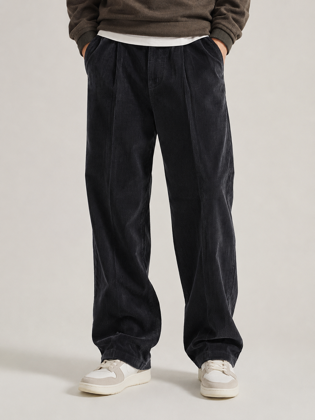 Dark Gray wide-leg corduroy trousers featuring double front pleats and a sharp center crease in a relaxed, straight-leg fit.