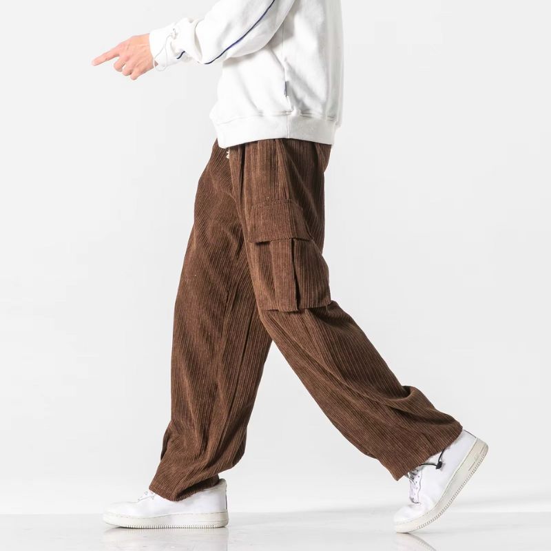 Brown wide-leg corduroy cargo pants shown in a walking pose