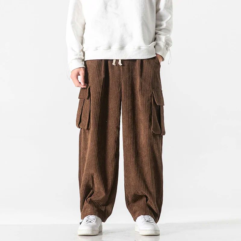 Brown wide-wale corduroy cargo pants with flap thigh pockets and drawstring waist