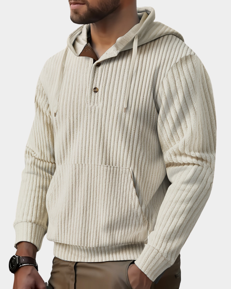 Cream wide-wale ribbed henley hoodie worn by a male model, showing the button placket, hood, and kangaroo pocket.