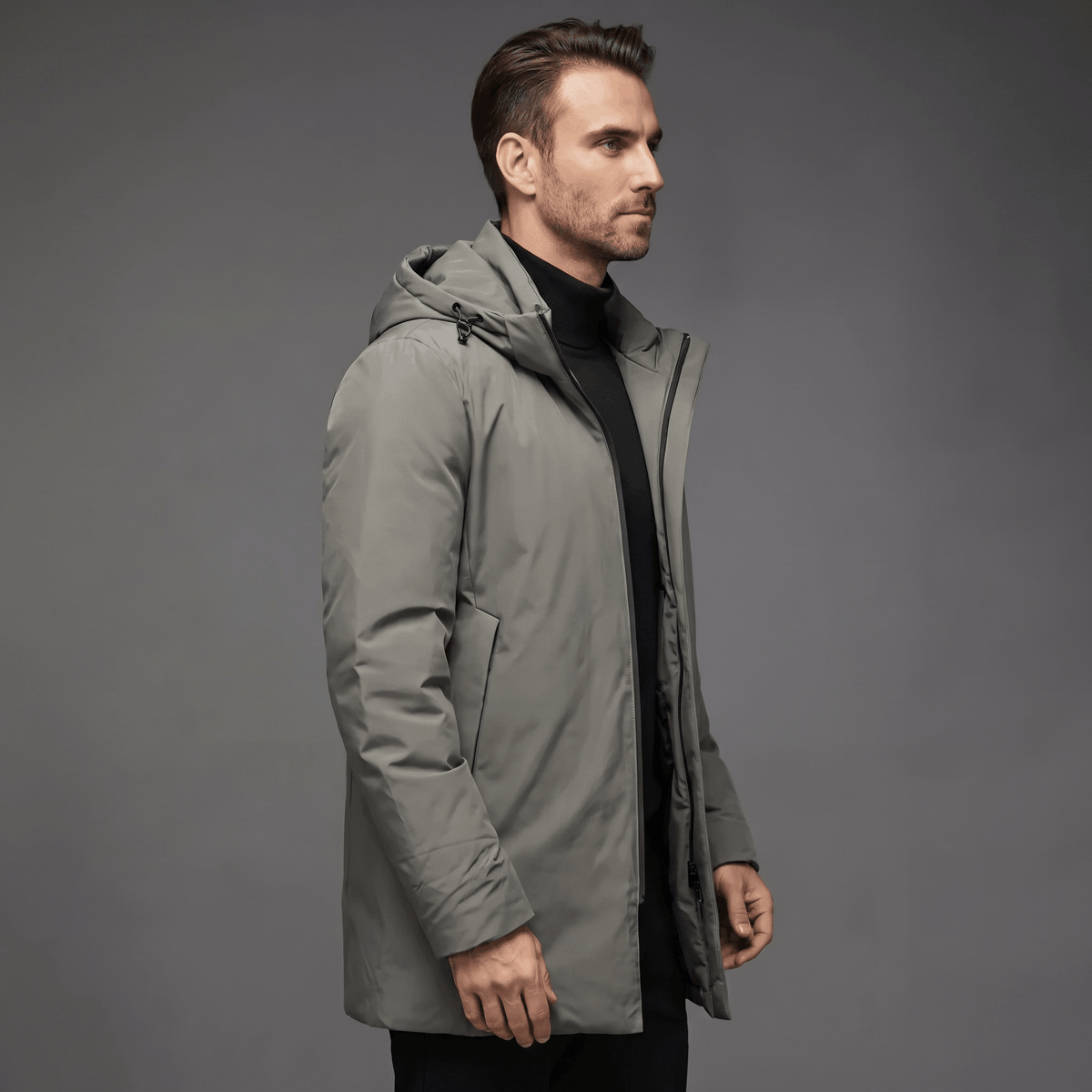 Grey wind and water-resistant winter parka with a protective hood, clean silhouette, and deep side pockets.