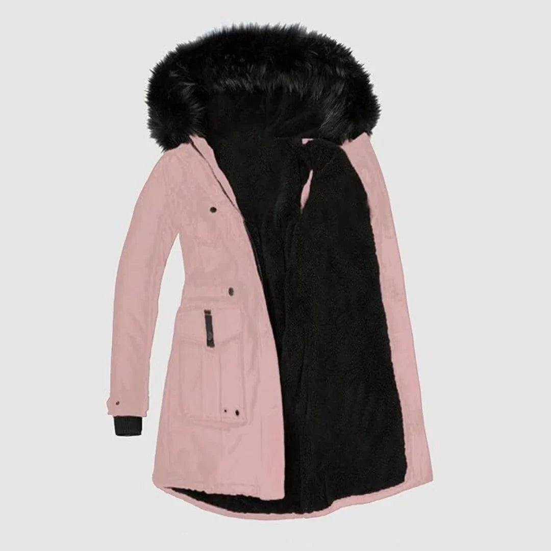 Blush pink parka with a black faux-fur lined hood, drawstring waist, and buttoned patch pockets.