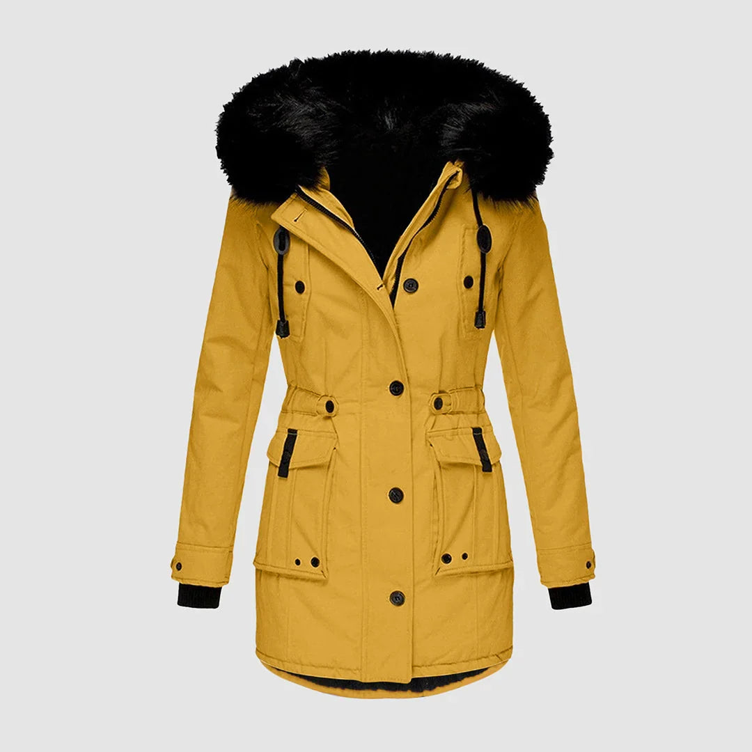 Mustard yellow parka with a plush black faux-fur hood, drawstring waist, buttoned front, and utility patch pockets.